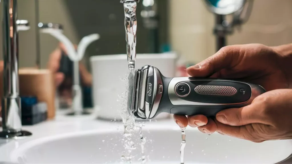 Close-up of a clean Clio electric shaver with cleaning tools on the side